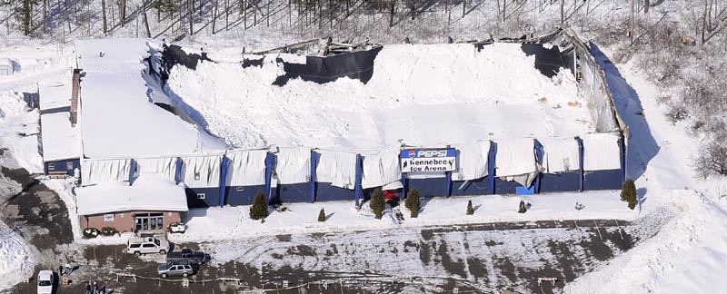 This aerial photo taken this morning shows the collapsed roof of the Kennebec Ice Arena in Hallowell. No one was injured when the roof feel onto to the ice rink yesterday afternoon.