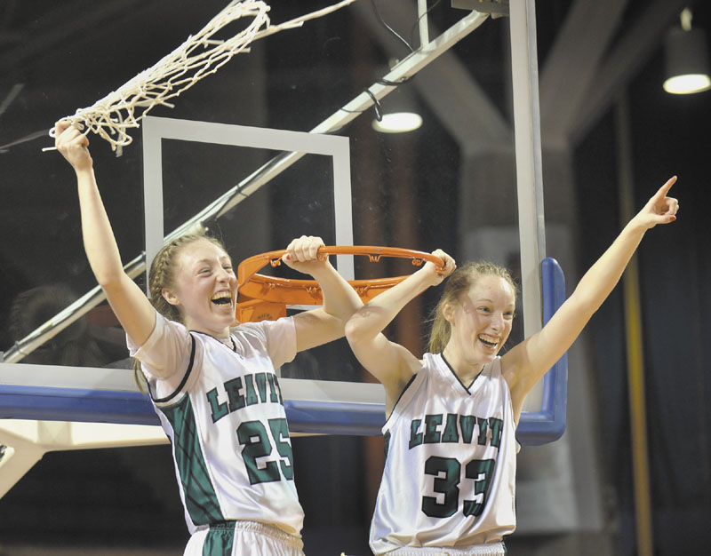 Kristin and Courtney Anderson of the Leavitt Area High School girls basketball team celebrate after the Hornets beat the Warriors in the Class B state championship game Friday in Portland.