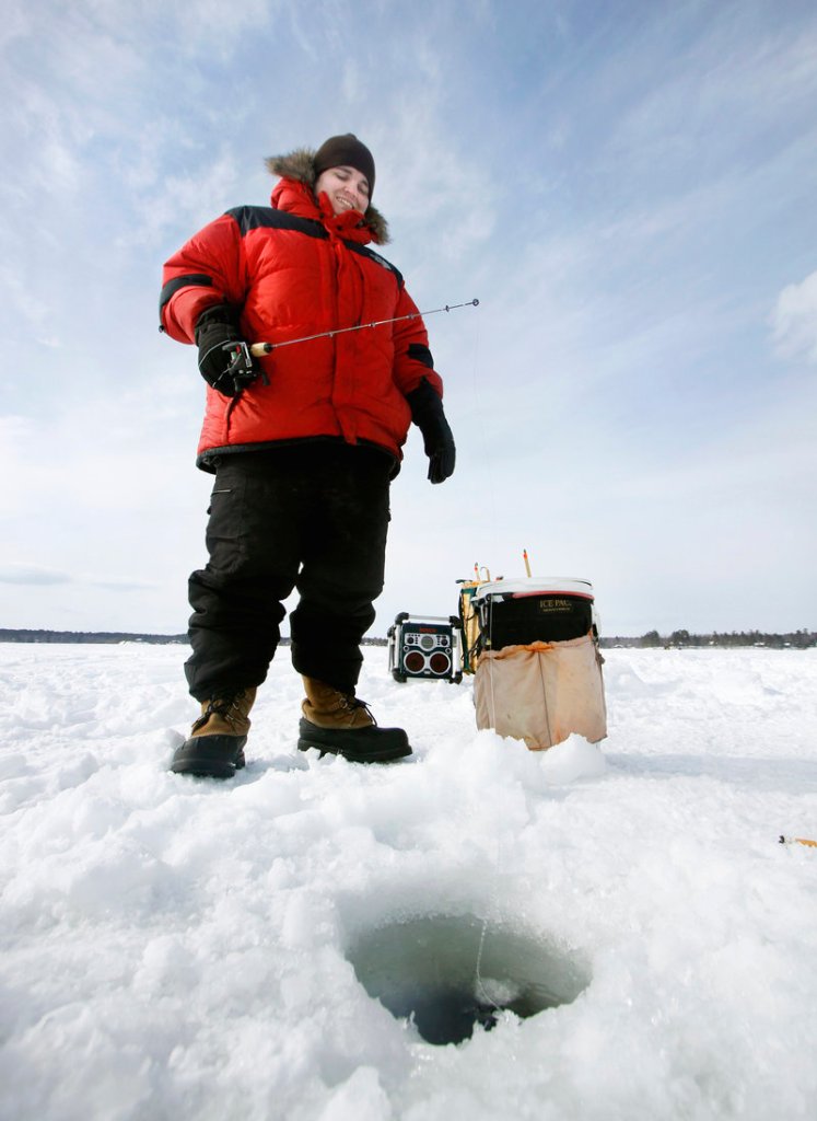 Colby Hakkila of Falmouth fishes on Jordan Bay during the Sebago Lake Rotary Club Derby on Feb. 26. Referring to stories of a togue in Sebago that could top the state record of 31.8 pounds and win the $100,000 derby prize, Hakkila said, “The hope is still alive.” He also said he would have to drill another hole to get it out.