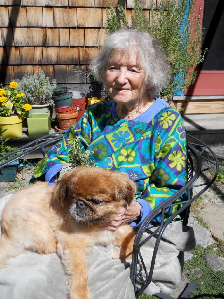 Muriel Zachary spends time with her dog Princess at home in Kennebunk last autumn. Mrs. Zachary had a lifelong passion for art.