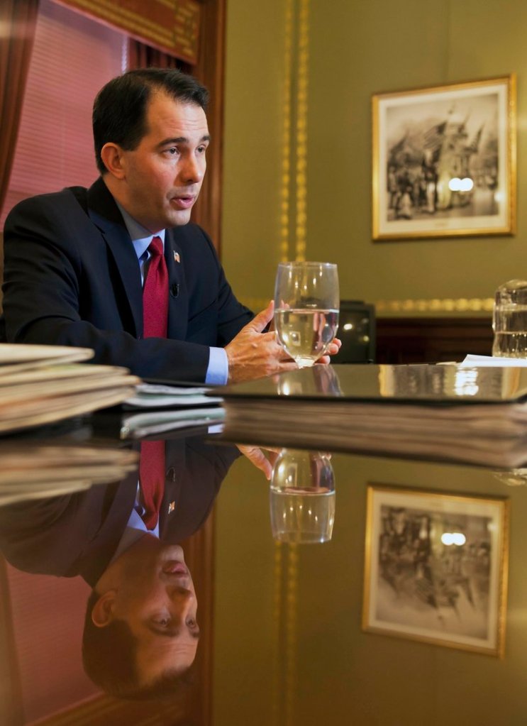 Wisconsin Gov. Scott Walker responds to an interview in his office in the Capitol in Madison.