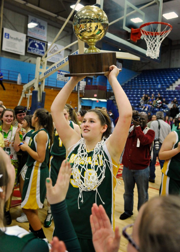 It’s the ultimate reward in Maine high school sports, the cherished Gold Ball, and Olivia Porch proudly displays it to the crowd after McAuley’s victory.
