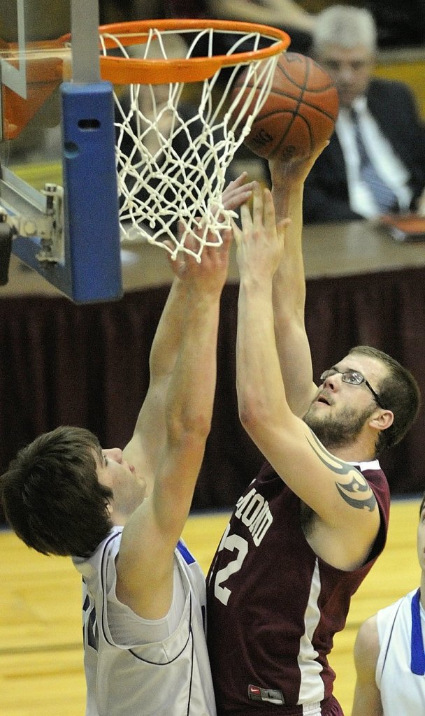 Richmond center Kyle O'Brien tries to shoot over Mike McClung during the Class D boys' state championship game Saturday at the Bangor Auditorium. The Panthers won their fourth title in seven years.