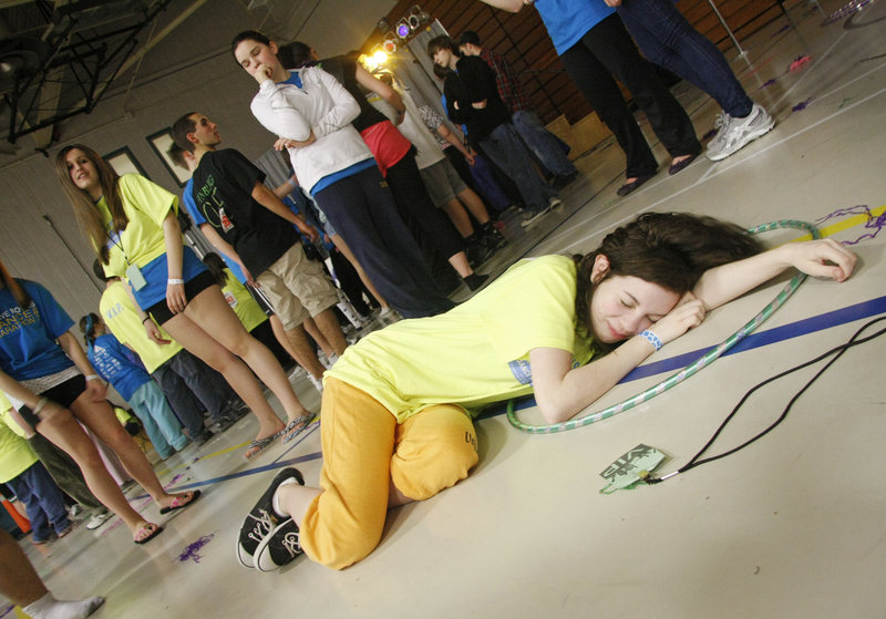 Gabrielle Roche of Scarborough High School rests near the end of the STRIVE Rocks Dance Marathon at USM in Portland on Sunday. Gabrielle and her twin, Samantha, raised $2,300 to support STRIVE on behalf of their brother, who has autism.