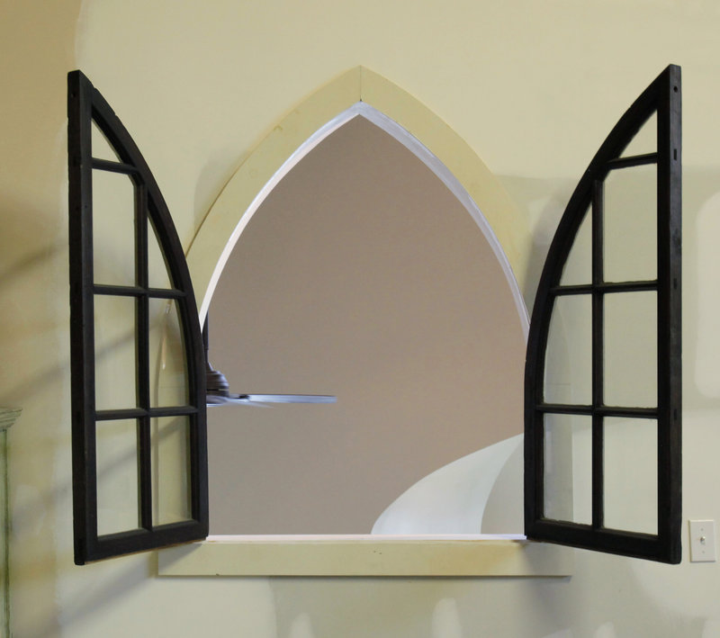 This graceful arched window looks out over the living space.