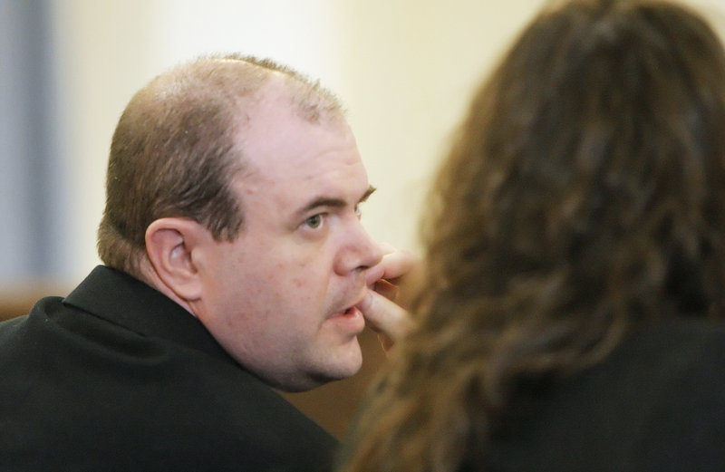Gary Traynham speaks with his lawyer Amy Fairfield in York County Superior Court in Alfred on Monday after the jury found him guilty on two charges for an assault on his ex-girlfriend in Sanford in 2009.