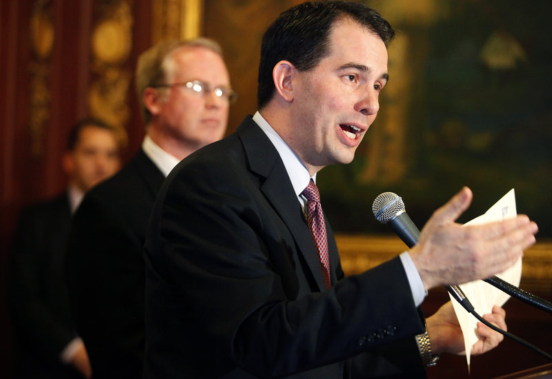 Wisconsin Gov. Scott Walker discusses a letter from Sen. Mark Miller on Monday. Walker rejected a request from Democrats that he meet with them to resume negotiations.