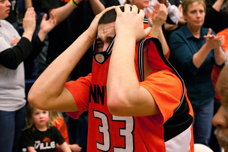 Xavier Grigg of Fennville (Mich.) High School reacts Monday after the Blackhawks won a tournament game following the death of teammate Wes Leonard. The star athlete died after making a game-winning shot last week.