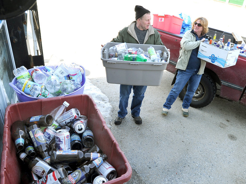 Dennis Mondville and Anne Maher of Cumberland unload returnables at the Yarmouth Beverage Redemption Center. Bottle bill critics disagree with suggestions that proposed changes in the law are part of the beverage industry's efforts to scuttle it.