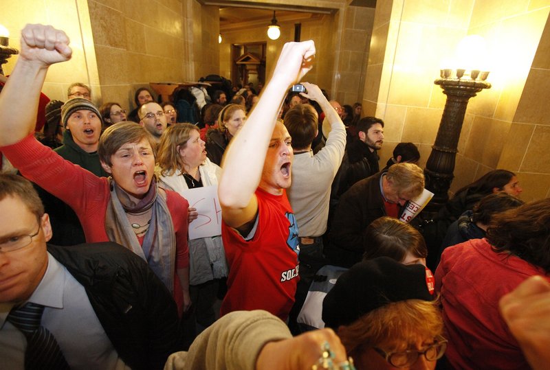 The Associated Press Protesters crowd the Capitol in Madison, Wis., on Wednesday night after the state Senate maneuvered to pass a bill eliminating nearly all collective bargaining rights for public employees.