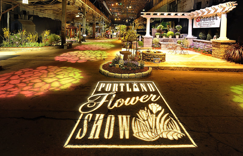 The grand entrance to the Portland Flower Show at the Portland Company Complex is enhanced by projected lighting.