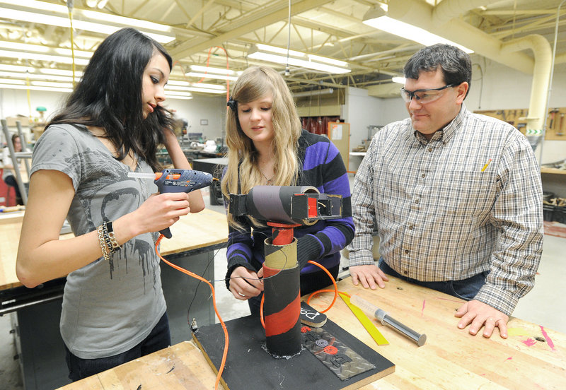 Gorham freshmen Katherine O’Connor and Julie Pearson work on a project as technology instructor Randy Perkins looks on. The school is ranked as one of the top 90 in Maine.