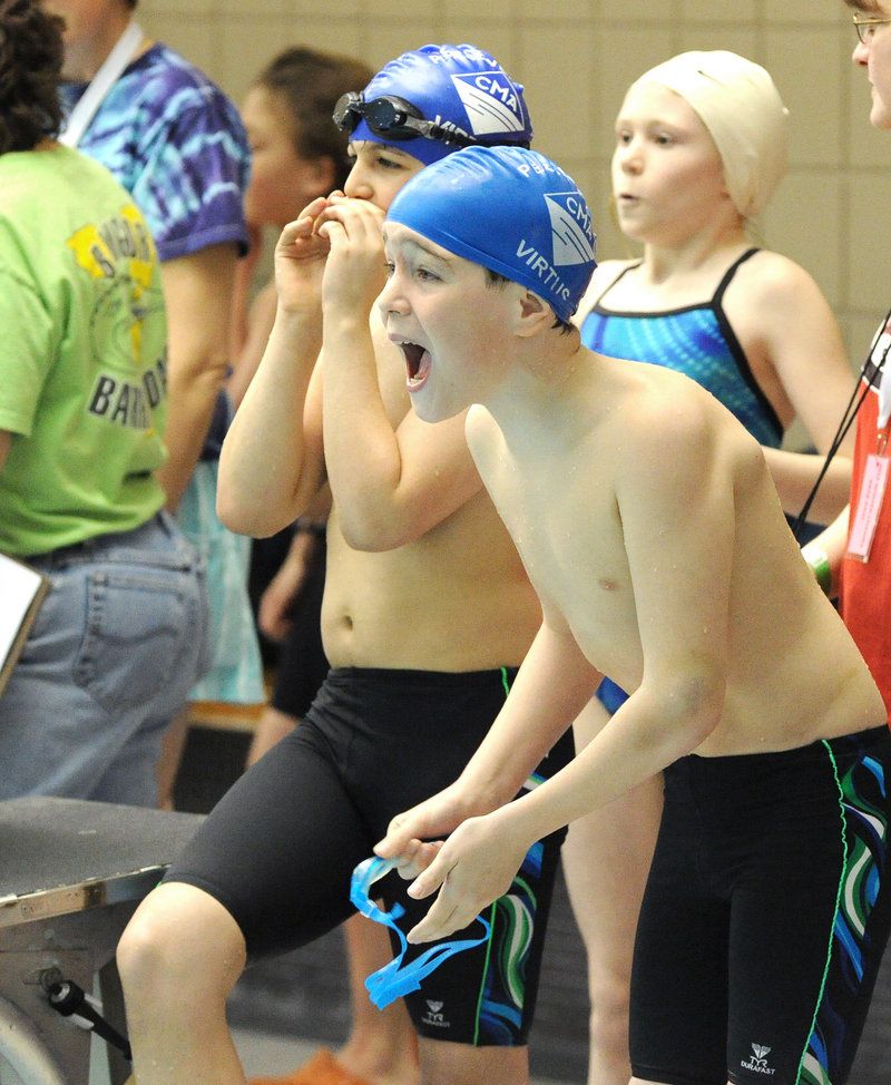 Noah Tilton of Scarborough cheers on teammates after competing in the opening leg of the 400-yard freestyle relay.