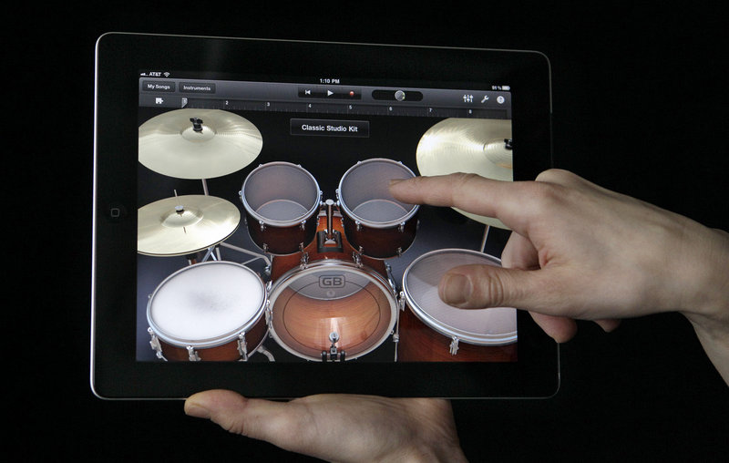 The new Apple iPad 2 is thinner and lighter than the iPad, comes with the Garage Band application, seen above, and the same base price as it did about a year ago – $499.