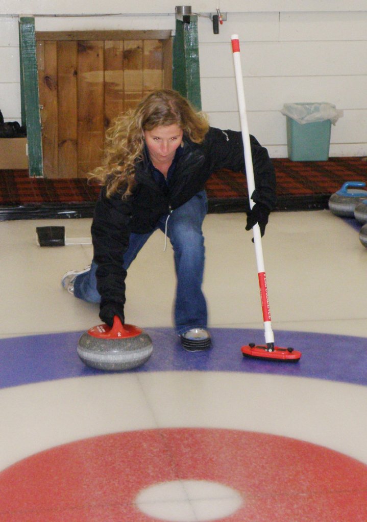 Shannon Bryan masters the art of not falling down while learning to curl with the Belfast Curling Club.