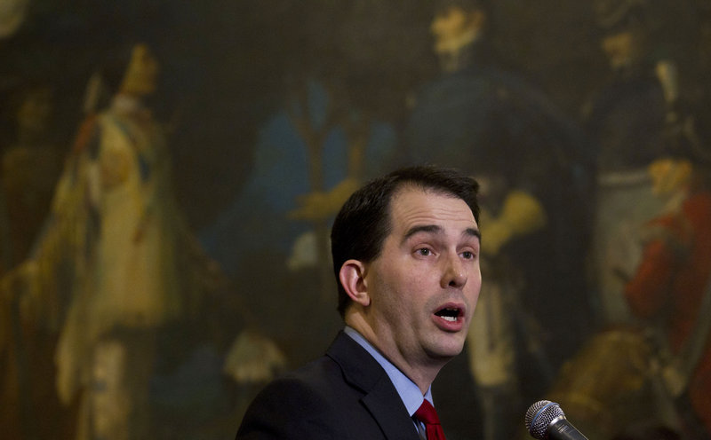 Wisconsin Gov. Scott Walker is proposing a nearly $1 billion cut in aid to schools in his two-year budget plan that would take effect in July. He argued that because of that, districts needed to get more money from their employees to help mitigate the loss in aid.