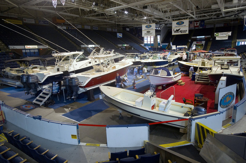 Powerboats in all shapes and sizes – and price ranges – fill the Cumberland County Civic Center on Friday. The 40th Maine Boat Show, held just weeks before the season begins, comes at a key time for sellers.