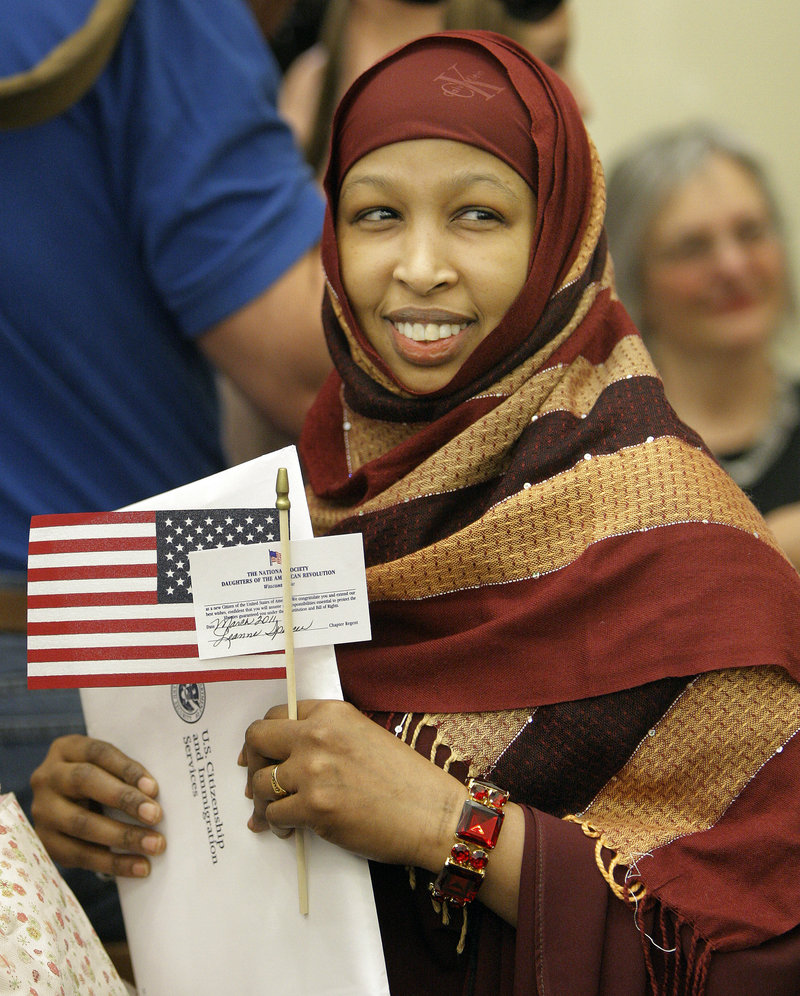 Sadya Roble, who came to the United States from Somalia, smiles after becoming a U.S. citizen Friday at U.S. District Court in Portland.