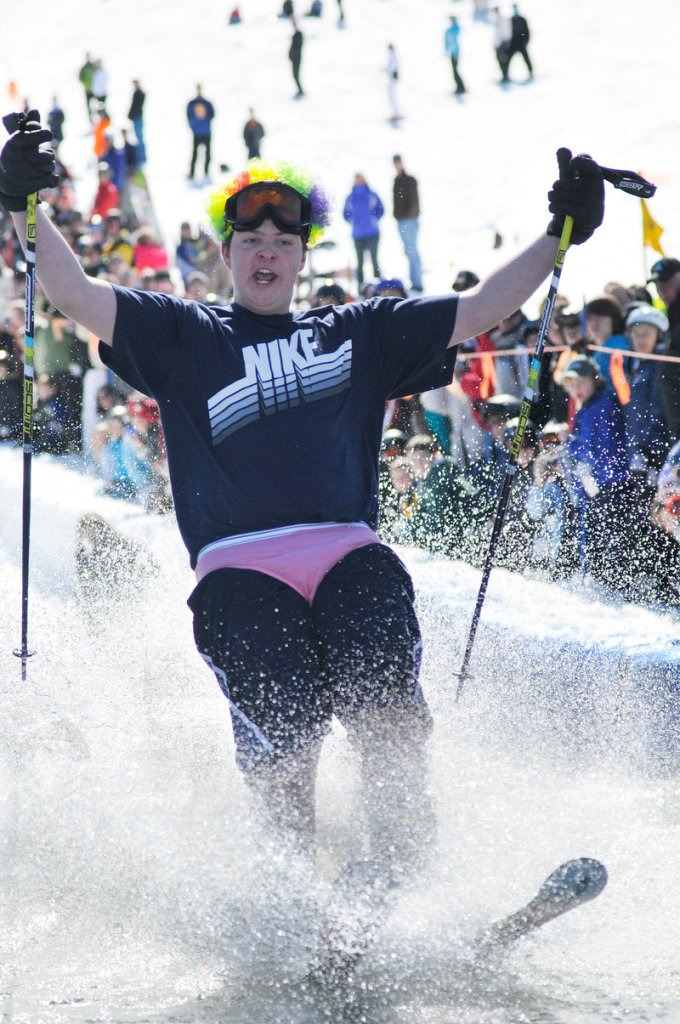 Chris Gagne of Raymond is dressed for a beach party as he competes in the Slush Cup.