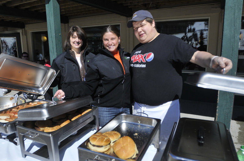 Serving up the barbecue on Saturday are Laurie Ramsay and Hattie Gushee, both of Fryeburg, and Morgan Gavett of Bridgton.