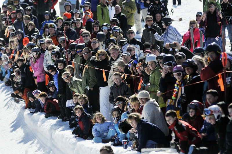 A crowd gathers to watch the Slush Cup at the 26th annual Spring Fling Beach Party at Shawnee Peak.