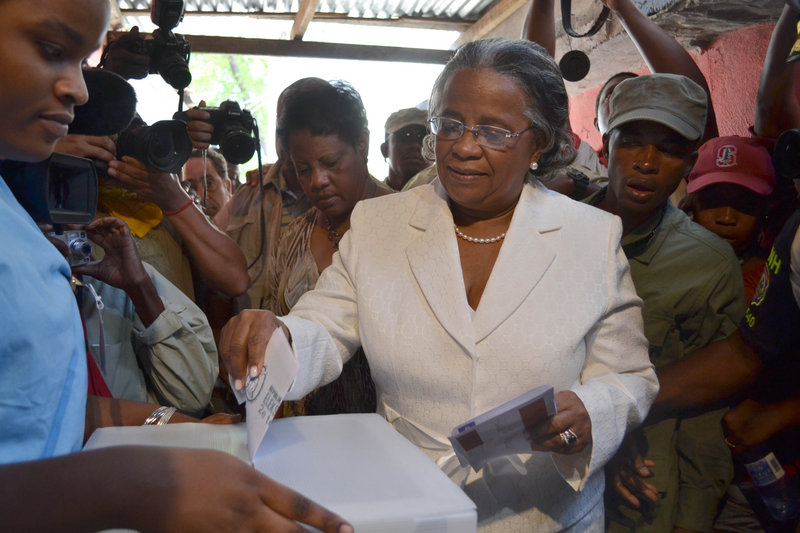 Presidential candidate Mirlande Manigat casts her ballot at a polling station in Port-au-Prince, Haiti, during the presidential runoff election Sunday.