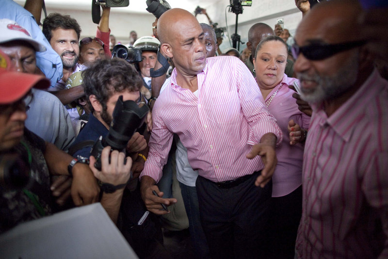 Candidate Michel Martelly gestures before casting his ballot at a polling station during the presidential runoff in Port-au-Prince, Haiti, Sunday.