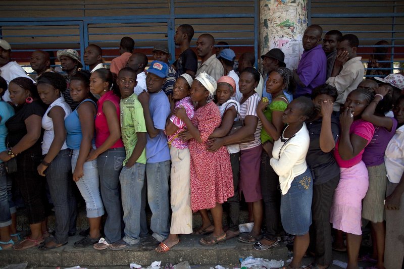 Haitians wait in line to cast their ballots Sunday at a polling station in Port-au-Prince. Voters in the presidential runoff chose between Mirlande Manigat, a former first lady, and Michel “Sweet Micky” Martelly, a star of Haitian music. Preliminary results are expected March 31.