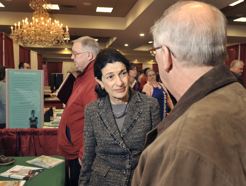 Maine Sen. Olympia Snowe chats Tuesday with a job fair visitor. She said the number of job seekers there “underscores the dimension of unemployment problems” in the state.