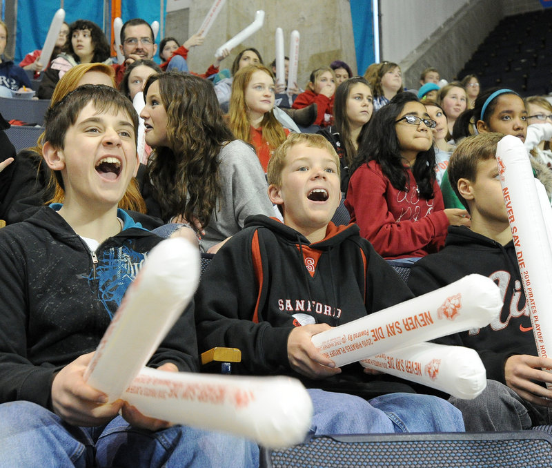 Sanford Junior High students Matt Webber, 12, left, and Peter Hegarty, 13, whoop it up for the Pirates.
