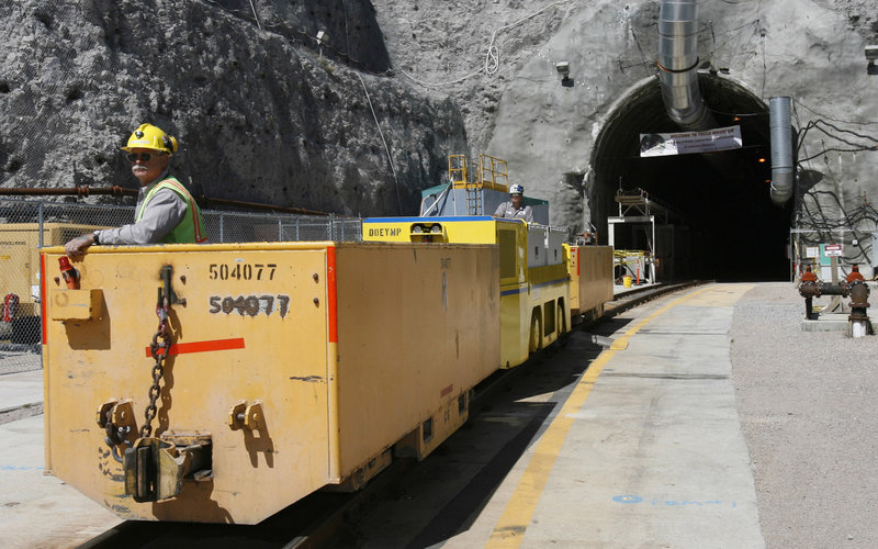 In this 2006 file photo, Pete Vavricka conducts a train at the entrance of Yucca Mountain in Nevada. The federal government spent $9 billion developing the project for the storage of nuclear waste, but the Obama administration has cut funding and recalled the license application to build it.
