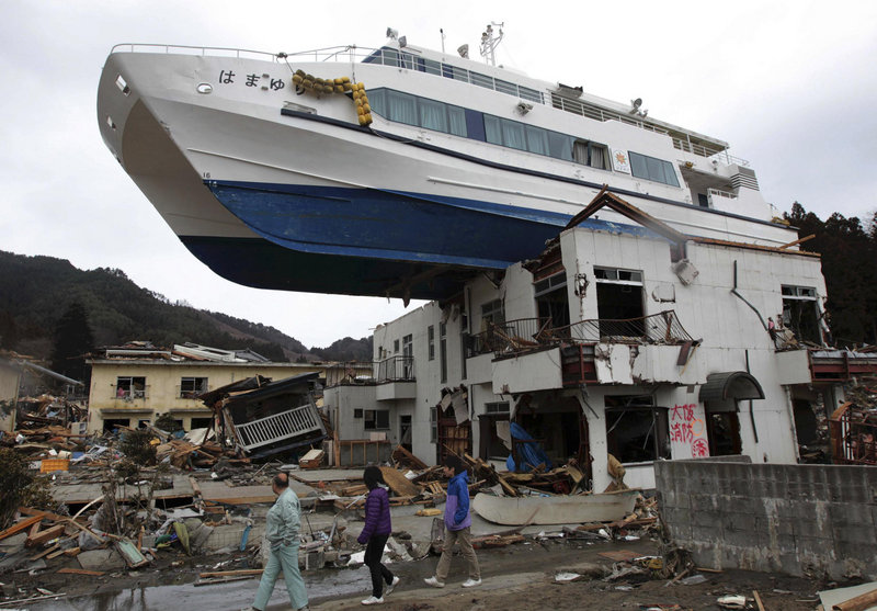 A boat sits atop a building Tuesday in Otsuchi, Japan, after a March 11 earthquake and tsunami that devastated a vast area of the nation’s northeastern coast. A nuclear crisis has complicated the government’s response to the disaster that killed about 18,000 people.
