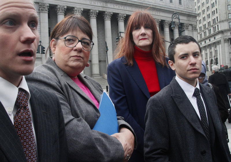 Attorney Noah Lewis, left, speaks during a news conference Tuesday after filing a lawsuit against New York City on behalf of transgender people seeking to change their birth certificates. Next to him from left to right are Joan Marie Prinzivalli, Patricia Harrington and Sam Berkley.