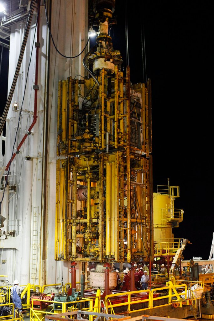 In this 2010 file photo, the Deepwater Horizon blowout preventer stack is lifted onto the deck of the Helix Q4000 in the Gulf of Mexico off Louisiana. A report released Wednesday identified the primary cause of the blowout preventer’s failure as the blind shear rams failing to close completely and seal the well because the drill pipe had buckled, bowed and become stuck.