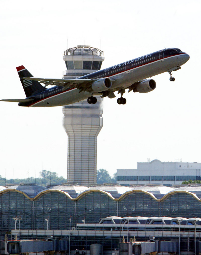 A plane takes off at Reagan National Airport, where an air traffic supervisor slept.