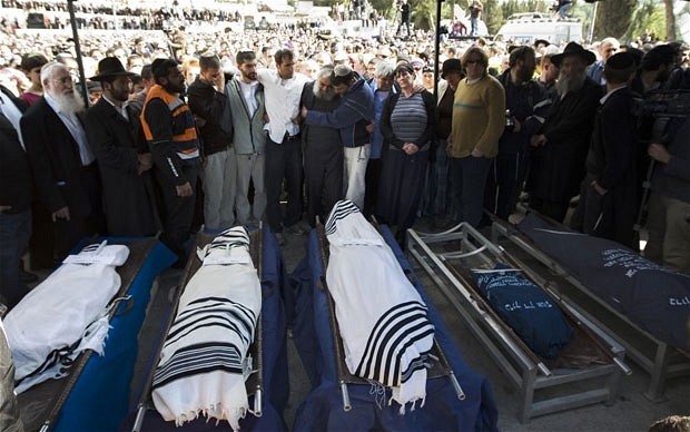 Mourners attend the funeral of the Fogel family in Itamar, Israel. A reader asks why the story of their murders wasn't reported more widely.