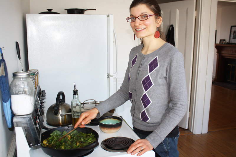 Food blogger Lauren Montanaro Norster stirs a curry in her Portland kitchen.