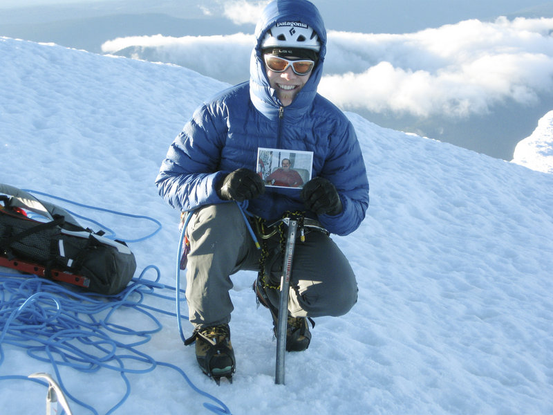Pat Connolly displays a picture of his late uncle, “Rockin’” Rod Scribner, at the summit of Mount Hood during last year’s Climb for Cancer Care. Connolly organizes the annual climbs to raise money for amenities for cancer patients in Maine Medical Center’s Gibson Pavilion.