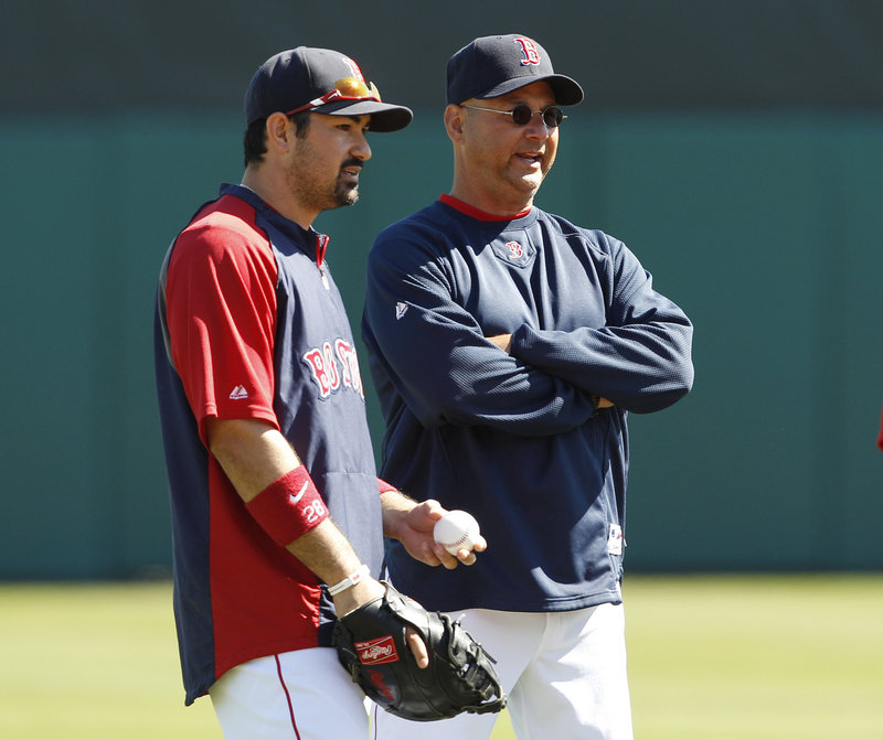 Red Sox Manager Terry Francona, right, will be working with a much-improved lineup this season, including the addition of first baseman Adrian Gonzalez, left.