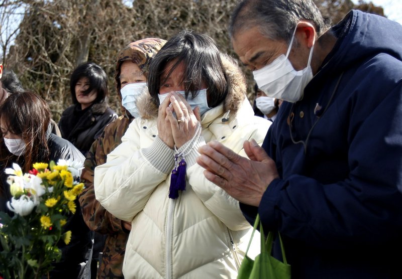 The Associated Press A Japanese mourner cries for a loved one during a mass funeral in Yamamoto, Japan, on Saturday for victims of the March 11 earthquake and tsunami.