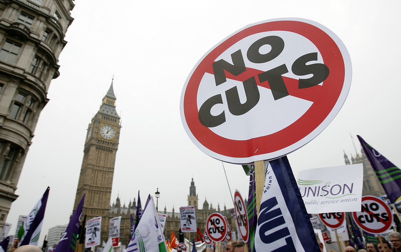 With Big Ben as a backdrop, demonstrators against the government s spending cuts march in London on Saturday.