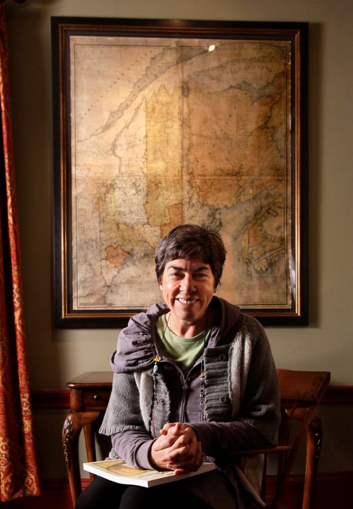 Roxanne Quimby, the conservation-minded founder of Burt’s Bees cosmetics, sits in front of a 180-year-old map of Maine at her home built by the Baxter family in Portland. “I have a big imagination ... but I’m really interested in getting things done,” she says.