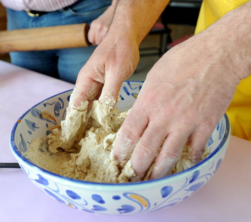 Steve Steinbock mixes flour and water for a batch of matzah. Congregation Bet Ha’am hosts “The Mystery of Matzah,” a celebration of ancient grains, this weekend.