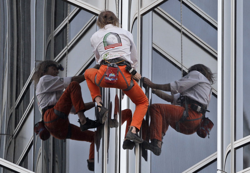 Frenchman Alain Robert, who calls himself "Spiderman," climbs up Burj Khalifa, the world’s tallest tower, in Dubai, United Arab Emirates, on Monday. The 48-year-old daredevil completed the half-mile climb in just over six hours.