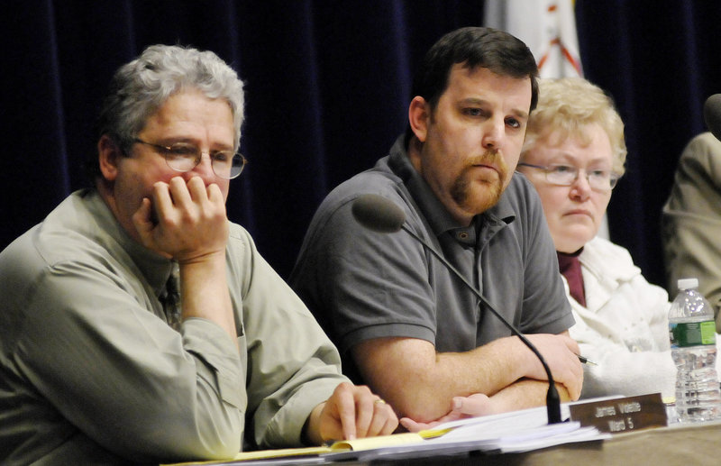 School Finance Committee members Jim Violette, left, Alex Stone and Mary Hall listen to comments at a public meeting on the Westbrook school budget Wednesday at the Performing Arts Center.