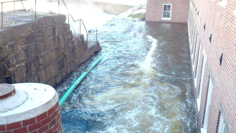 Photos provided by the Biddeford Department of Code Enforcement & Emergency Management show flooding today at the Saco Mill by the Falls apartment complex.