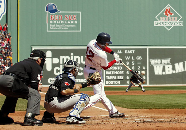 Boston's Jed Lowrie connects on a two-run single during a game against the Blue Jays at Fenway on Monday.