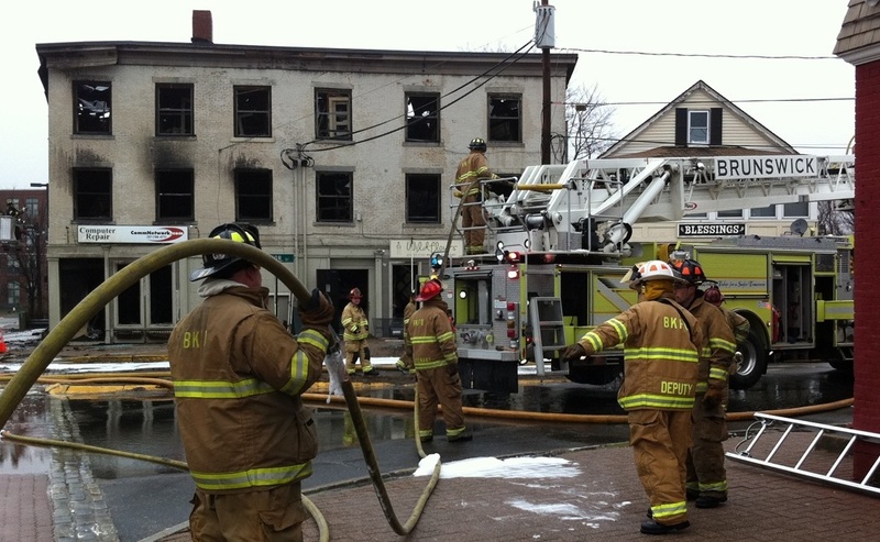 A three-alarm fire at 45 Maine St. in Brunswick destroyed apartments, a bakery and other businesses.