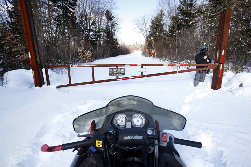 A snowmobile is parked outside a gate on land owned by conservationist Roxanne Quimby, the founder of Burt's Bees cosmetics company. Quimby wants to donate thousands of acres to the federal government for the creation of a North Woods National Park. Members of Maine's congressional delegation have reacted cooly to Quimby's proposal.