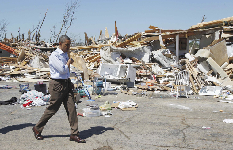 President Barack Obama tours tornado damage in Tuscaloosa, Ala., today.
